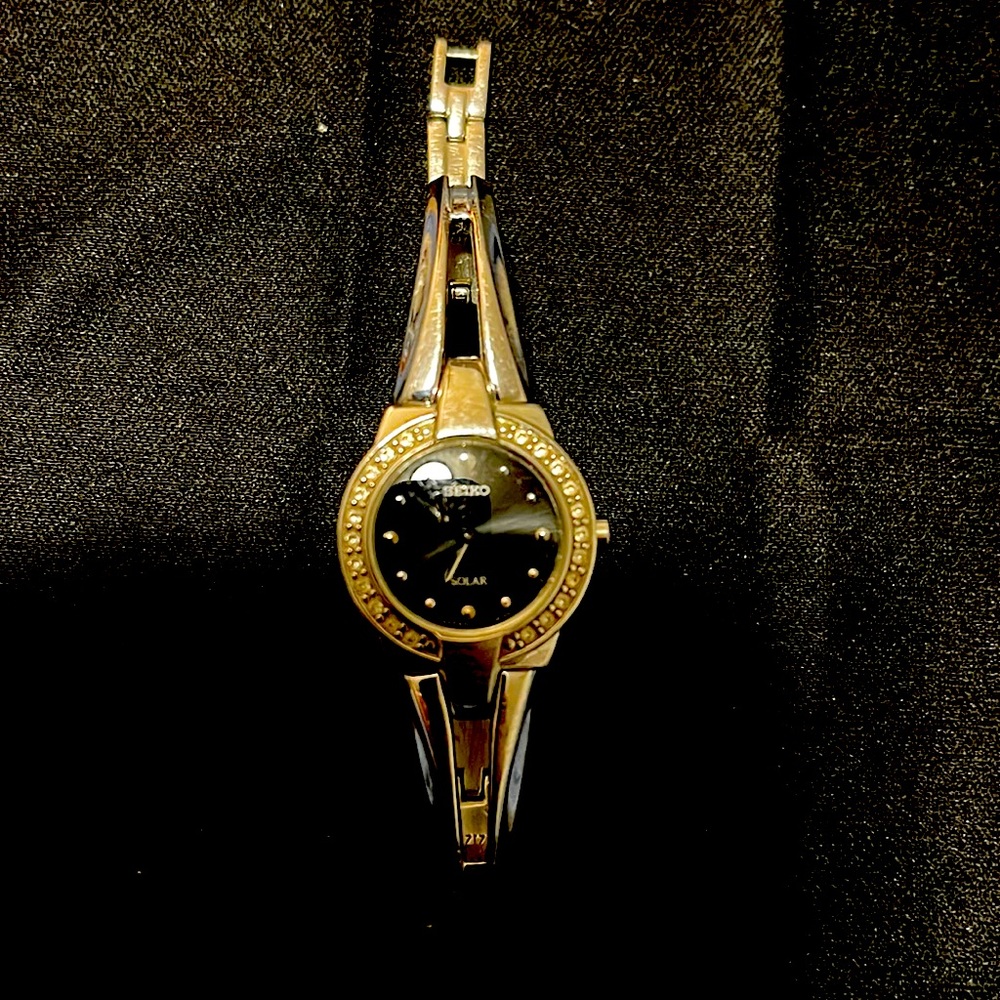 Seiko watch with stones.